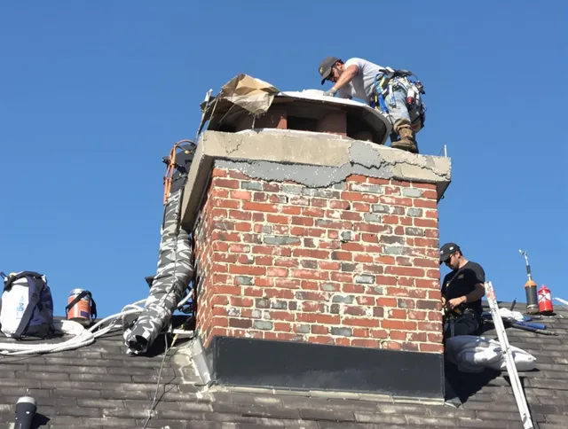 Sharon Chimney Sweep installing a custom chimney crown in Sharon, MA