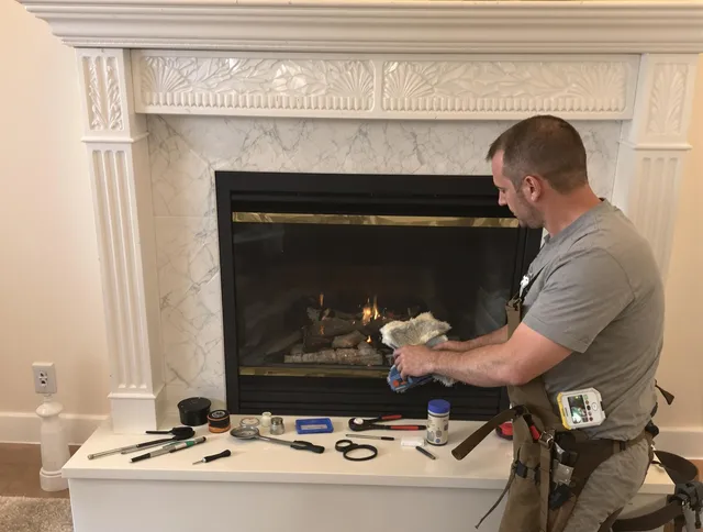 Sharon Chimney Sweep performing fireplace maintenance in Sharon, MA